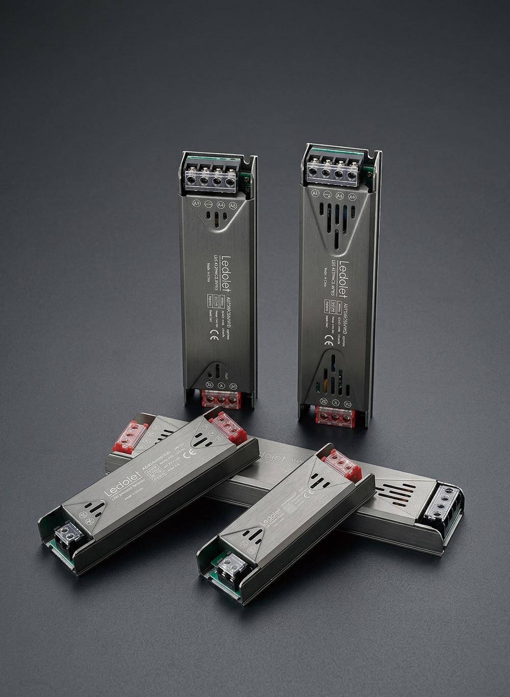 Premium industrial switching power supplies and LED drivers with durable metallic casings, designed for high-performance commercial lighting systems.